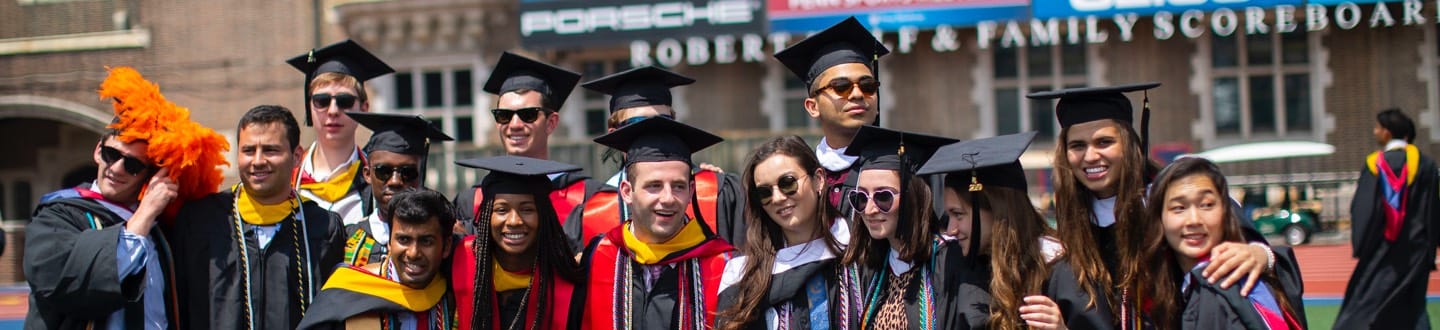 Group of Penn graduates posing for photo
