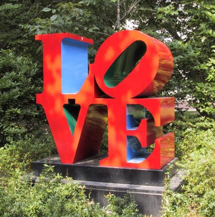 Red and blue Love statue in garden at Penn
